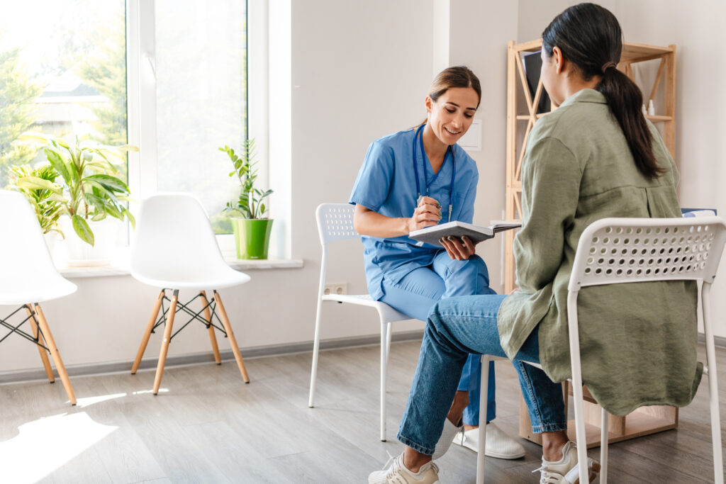 Patient Recruitment for clinical trials strategy. Doctor conducts an interview with patient.
